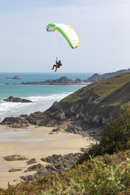Paragliding along the cliffs of Plouha